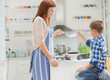 © Tom Merton/KOTO - Mother and son baking in kitchen