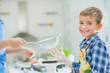 © Tom Merton/KOTO - Father and son baking in kitchen