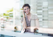 © Robert Daly/KOTO - Businesswoman talking on cell phone