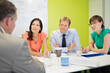 © Robert Daly/KOTO - Business people talking in meeting