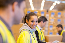 Worker Smiling In Warehouse