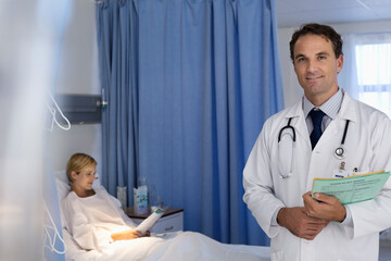 Wall Mural - Doctor smiling in hospital room