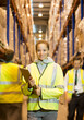 © Paul Bradbury/KOTO - Worker holding clipboard in warehouse