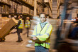 © Paul Bradbury/KOTO - Worker holding clipboard in warehouse