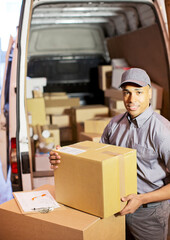 Wall Mural - Delivery boy loading boxes into van