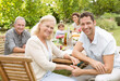 © Chris Ryan/KOTO - Mother and son smiling in backyard