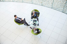 High Angle View Of Business People In Meeting
