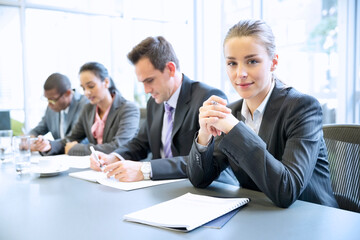 Portrait of confident businesswoman in meeting