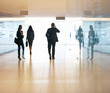 © Tom Merton/KOTO - Business people walking in lobby