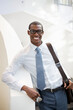 © Tom Merton/KOTO - Portrait of smiling businessman on staircase