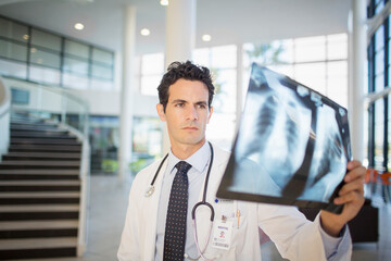 Wall Mural - Doctor viewing chest x-rays in hospital