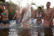 Friends wading in river