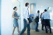 © Sam Edwards/KOTO - Business people walking in office