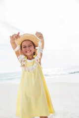 Poster - Girl playing with seashells on beach