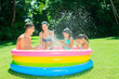© Dan Dalton/KOTO - Family playing together in wading pool