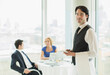 © Martin Barraud/KOTO - Waiter smiling in restaurant