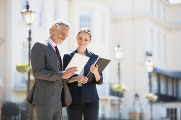 Business people talking on city street