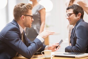 Businessmen talking in office