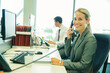 © Robert Daly/KOTO - Businesswoman talking on telephone in office