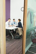 © Chris Ryan/KOTO - Business people talking in meeting
