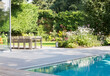 © Astronaut Images/KOTO - Table and chairs by outdoor swimming pool