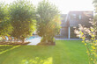 © Astronaut Images/KOTO - Modern house overlooking sunny backyard