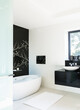 © Astronaut Images/KOTO - Wall art and soaking tub in modern bathroom