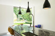 © Astronaut Images/KOTO - View of backyard beyond modern kitchen