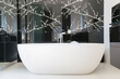 © Astronaut Images/KOTO - Wall art and soaking tub in modern bathroom