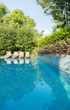 © Astronaut Images/KOTO - Lounge chairs by swimming pool