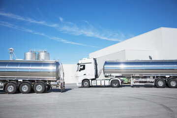 Stainless steel milk tankers parked