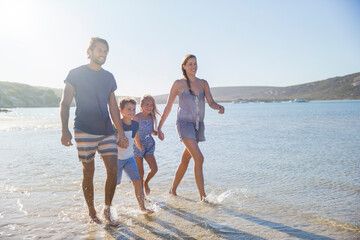 Family walking together along shore