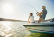 canvas print picture - Father and son fishing on boat 