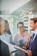 © Dan Dalton/KOTO - Business people talking in office building