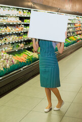 Poster - Clerk holding blank card in grocery store