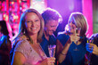 © Dan Dalton/KOTO - Friends with champagne flutes having fun in nightclub