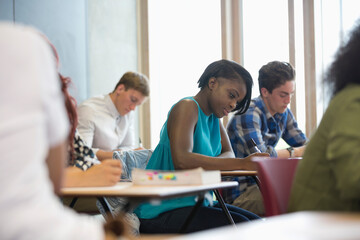 Wall Mural - View of students sitting at desks during test in classroom 