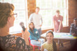 © Tom Merton/KOTO - Audience listening to speaker at community center