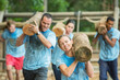 © Sam Edwards/KOTO - Determined people running with logs on boot camp obstacle course