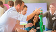 © Tom Merton/KOTO - Business people stacking green blocks