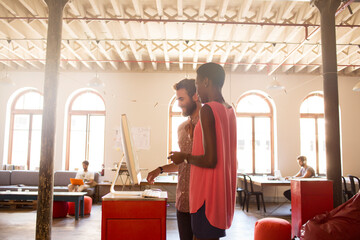 Wall Mural - Creative business people working at computer in open office