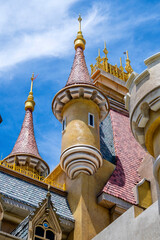 Wall Mural - Towers with a weather vane on a sunny day and a new roof with roofing tile on island of Phu Quoc, Vietnam