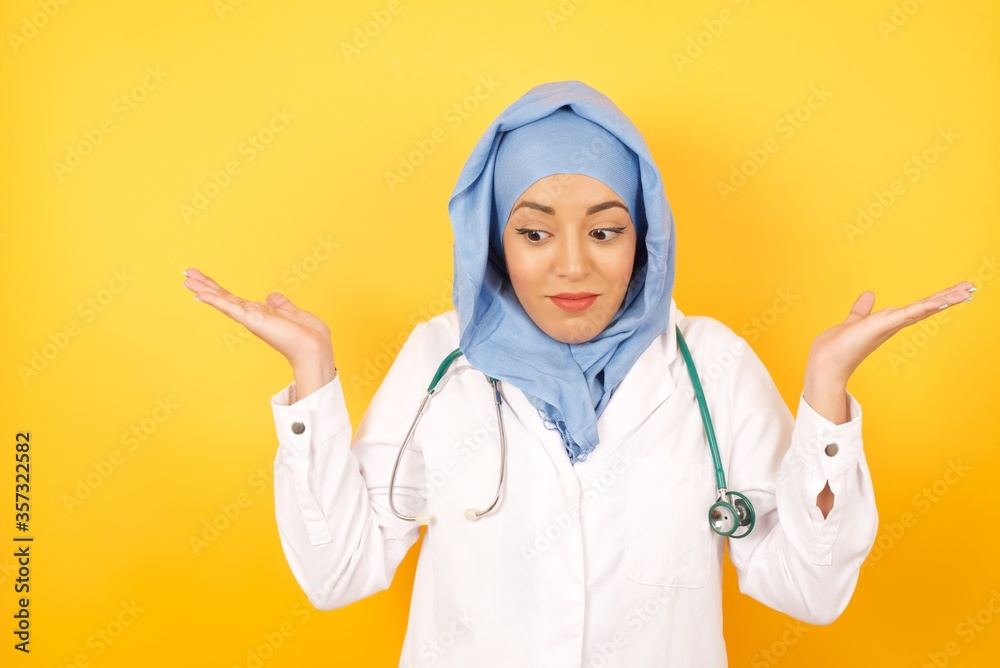 Hesitant young Caucasian Doctor man wearing medical uniform over white ...