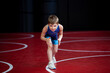 Young female wrestler in a blue singlet