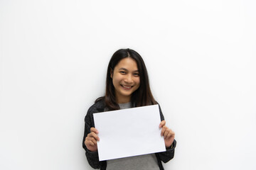 Woman showing blank white paper for copy space