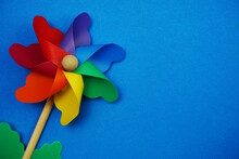 Colorful Pinwheel With Space Copy Isolated On Blue Background