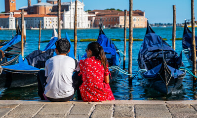 Wall Mural - Romantic travel couple in Venice enjoying beautiful view. Vacation and holidays concept.