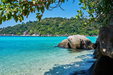 Wall Mural - Tropical scenery view. Beach of Tioman island in Malaysia with perfect white sand, turquoise water and deep blue sky. Idyllic landscape. Summer vacation and tropical beach concept.