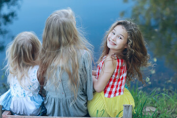 girlfriends funny children playing in the summer / group of girls having fun on a summer day, girlfriends children, summer vacation