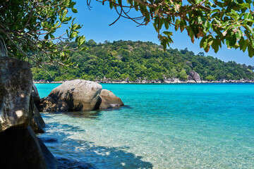 Wall Mural - Beach at Tioman island with blue sky turquoise water and granite rocks. Amazing tropical holidays in paradise beaches.